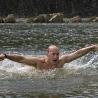 Russian President Vladimir Putin, now 62 years old, takes a dip during his vacation outside the Siberian town of Kyzyl on Aug. 3, 2009. | AFP-JIJI