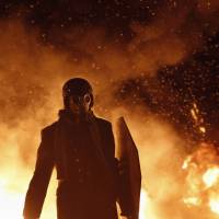 A pro-European protester wears a gas mask during street violence in Kiev, Ukraine, on Jan. 23. | REUTERS