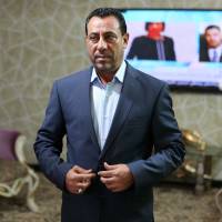 Hakim al-Zamili, a parliament member and head of Iran\'s Security and Defense Committee, prepares for an interview with The Associated Press in Baghdad on Wednesday. Mixed reactions were voiced in Baghdad over Pentagon reports that Iran launched airstrikes in Iraq against the Islamic State group. | AP