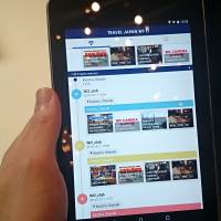 A tablet computer runs the Japan Travel Wi-Fi app. | KAZUAKI NAGATA