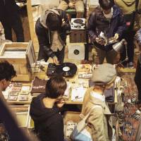 Digging in the crates: People shop for music at the Red Bull Music Academy’s Culture Fair in Tokyo last month. Rock, J-pop and dance: Albums we liked in 2014