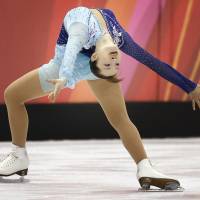 Iconic moment: Shizuka Arakawa performs an \"Ina Bauer\" during her free skate at the Turin Olympics on Feb. 23, 2006, where she became the first Japanese to win the gold medal. | AP