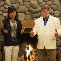 Thumbs up: Old Nic shows off a deerskin jacket designed by Teruki Uchise (left) at his Afan Woodland Trust Centre in Kurohime, Nagano Prefecture.Conan Morimoto | COURTESY OF C.W. NICOL