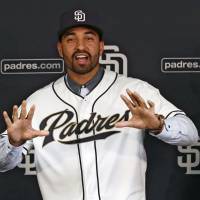 Not your father’s Padres: New Padres outfielder Matt Kemp poses for pictures during a news conference on Friday in San Diego. Kemp was acquired in a trade with the Los Angeles Dodgers. Padres retool with blockbusters