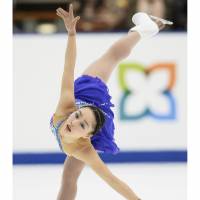 Raising her profile: Wakaba Higuchi, 13,  seen performing to \"Piano Concerto in F\" during Sunday\'s free skate, earned a third-place finish at nationals. | KYODO