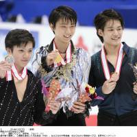 Their reward: Champion Yuzuru Hanyu (center), silver medalist Shoma Uno (left) and Takahiko Kozuka claimed the top three men\'s spots at the All-Japan Championships. | KYODO