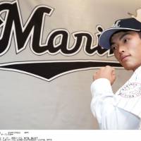 Top of the class: Right-hander Eisuke Tanaka poses after joining the Chiba Lotte Marines on Tuesday. | KYODO