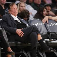 Exit, stage right: Los Angeles Clippers owner Donald Sterling watches his team play in 2010. Sterling was stripped of his ownership after racist comments he made surfaced in April.  | AP