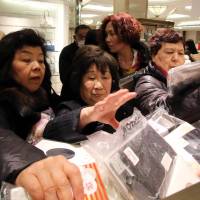 Competition is fierce as shopper ransack a Tokyo department store on Jan. 2.   | AFP-JIJI