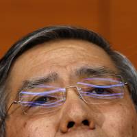 Bank of Japan Gov. Haruhiko Kuroda holds a news conference at the central bank in December. | REUTERS
