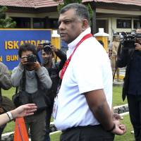 AirAsia Group CEO Tony Fernandes arrives at the command center of the search operation for the victims of AirAsia Flight QZ8501 at the airport in Pangkalan Bun, Indonesia, on Wednesday. AirAsia boss credited for deft response to tragedy
