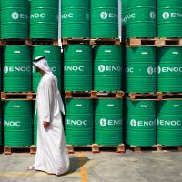 The plunge in oil prices has breathed new life into the Japanese economy, helping cut gasoline and electricity prices while boosting corporate earnings, economists say. | BLOOMBERG