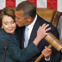 U.S. House Speaker John Boehner kisses House Minority Leader Nancy Pelosi while clutching the gavel, after being re-elected speaker on the House floor at the U.S. Capitol in Washington on Tuesday. | REUTERS