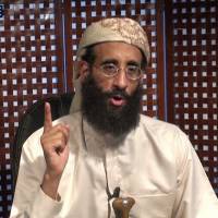U.S.-Yemeni radical Anwar al-Awlaki speaks during a 2010 video lecture at an unknown location. The younger brother of Said Kouachi, one of the suspects in the attack against French satirical magazine Charlie Hebdo on Jan. 7, said Kouachi made a trip to Yemen in 2011 that was financed by al-Awlaki. It is believed siblings Cherif and Said Kouachi trained in Yemen in 2011. | AFP-JIJI/HO/SITE INTELLIGENCE GROUP