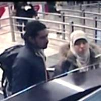 This photo distributed on Monday by the Turkish Ihlas News Agency shows Hayat Boumeddiene presenting her passport at Sabiha Gokcen airport in Istanbul on Jan. 2 after arriving from Madrid. Boumeddiene, the wanted partner of one of the gunmen behind the terror attacks in France last week, crossed into conflict-torn Syria on Jan. 8 after traveling through Turkey, Turkish Foreign Minister Mevlut Cavusoglu said Monday. | AFP-JIJI