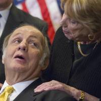 Former White House press secretary James Brady looks at his wife, Sarah, during a news conference on Capitol Hill on March 30, 2011, the 30th anniversary of the shooting that left him paralyzed. | AP