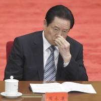 Zhou Yongkang, the Chinese Communist Party Politburo Standing Committee member in charge of security, attends a conference to celebrate the 90th anniversary of the founding of Chinese Communist Youth League at the Great Hall of the People in Beijing on May 4, 2012. | AP