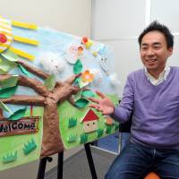 Michiro Morishita, a division manager for the nonprofit organization Florence, discusses day care services for disabled children during an interview at the NPO\'s office in Tokyo on Dec. 16. | YOSHIAKI MIURA
