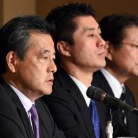 Katsuya Okada (left), seeking the top post in the Democratic Party of Japan, speaks as his two opponents, Goshi Hosono (center) and Akira Nagatsuma, look on at a news conference at the Foreign Correspondents\' Club of Japan in Tokyo on Thursday. | AFP-JIJI
