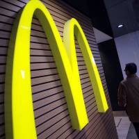 McDonald\'s admits inedible items have been found in food for some time. Critics accuse it of a lack of transparency, and say customers expect more than a mere apology. | AP