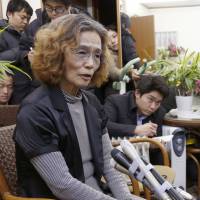 Junko Ishido, the mother of hostage Kenji Goto, speaks to the media at her home in Koganei, west Tokyo, late Wednesday. | AP