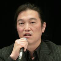 Journalist Kenji Goto delivers a lecture during a symposium organized by UNICEF in Tokyo in October 2010. | AFP-JIJI