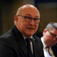 French Finance Minister Michel Sapin speaks to the press at the French ambassador\'s residence in Tokyo on Monday. Sapin is in Japan on the last leg of an Asian tour. | AFP-JIJI