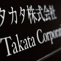At least five deaths — four in the United States — have been linked to faults with air bag inflators manufactured by Takata Corp., headquartered at this building in Tokyo. Takata airbag victim's husband saw his wife and baby's lives ebb away
