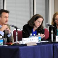 From left, Nolan McCarty, chair of the Department of Politics at Princeton University, answers a question as Madeline Zavodny, a professor at Georgia\'s Agnes Scott College, and Sarah Kreps, an assistant professor of government at Cornell University, listen at a symposium, \"Where is the U.S. going? &#8212; Pictures of the U.S. in 2025,\" organized by the Keizai Koho Center in Tokyo on Nov. 21. | SATOKO KAWASAKI