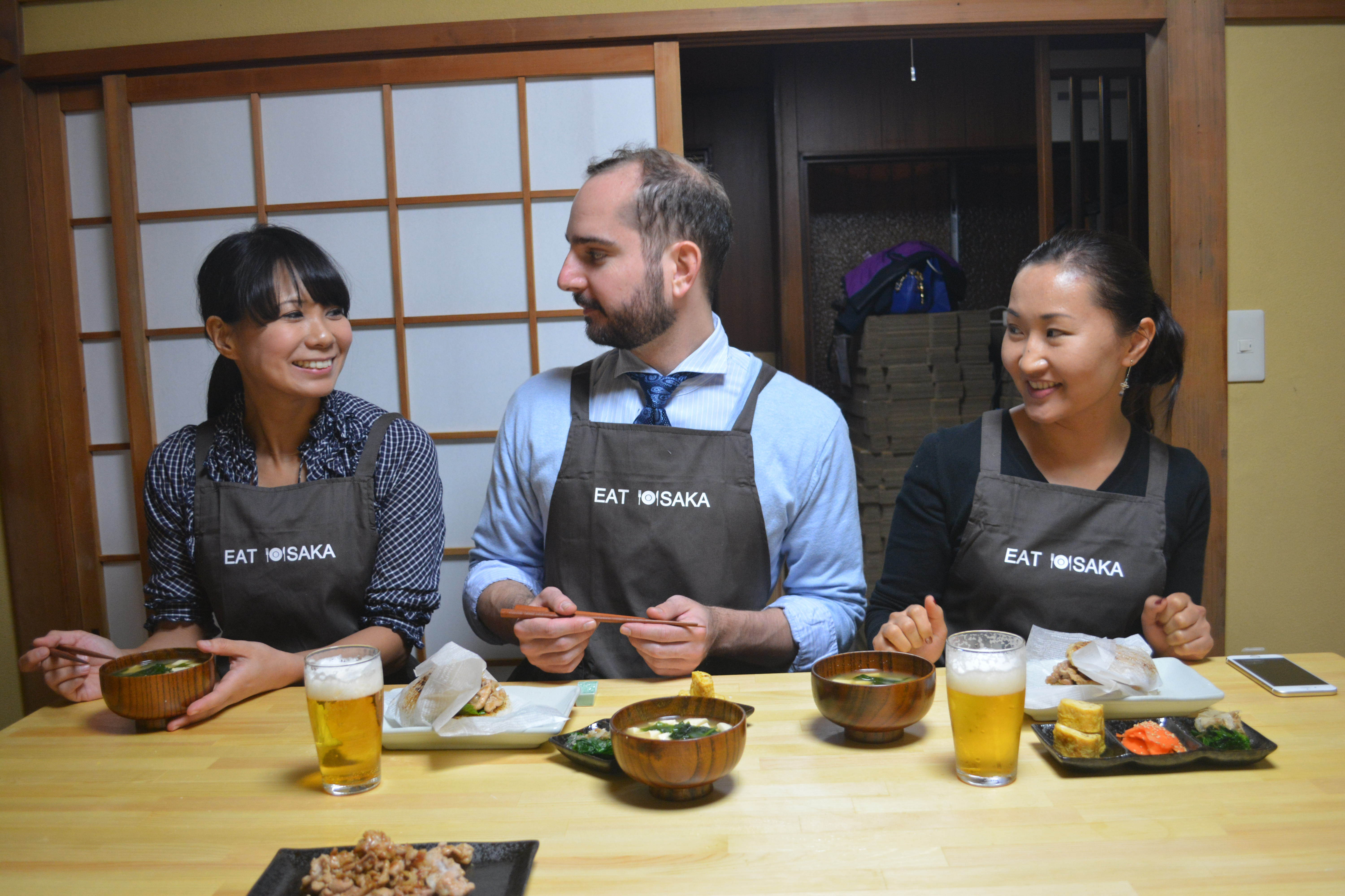 Bon appetit: Arisa Daggers (left) sits down with her students for a meal after an Eat Osaka class. | J.J. O'DONOGHUE
