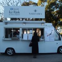 To go, please: Chef Yoshihiro Narisawa mans his food truck by Tokyo Midtown. | ROBBIE SWINNERTON