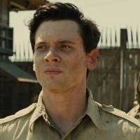 Camp torture porn?: Louis Zamperini (Jack O\'Connell) is tormented by \"The Bird\" (Takamasa Ishihara, aka Miyavi) in \"Unbroken.\" | AP