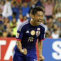 Fired up: Japan’s Shinji Kagawa celebrates his 82nd-minute goal against Jordan in an Asian Cup mach on Tuesday in Melbourne, Australia. Japan beat Jordan 2-0 to win Group D. Honda strikes again as Japan prevails against Jordan, finishes atop Group D