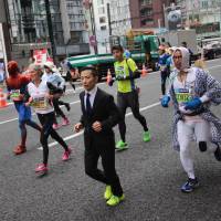 A collection of characters make their way through the streets of Ginza during the 2015 Tokyo Marathon on Feb. 22. | MARK THOMPSON