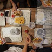Customers eat at the Shake Shack in New York\'s Theater District. | BLOOMBERG