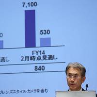 Kenichiro Yoshida, chief financial officer with Sony Corp., speaks at a news conference in Tokyo on Wednesday. Yoshida\'s focus on restructuring has cut costs and stemmed losses in consumer electronics, helping to restore credibility with investors. | BLOOMBERG