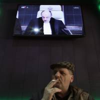 A man watches the International Court of Justice\'s verdict on genocide during the Balkan wars in Vukovar, Croatia, on Tuesday. | REUTERS
