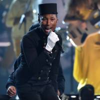Pharrell Williams performs at the 57th annual Grammy Awards in Los Angeles on Sunday. Smith, Pharrell lead Grammys, Perry spotlights domestic abuse