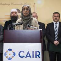 Outreach Manager for the Council on American Islamic Relations Zainab Chaudry speaks Monday at the Muslim Community Center in Silver Spring, Maryland, reacting to the Chapel Hill shootings and to urge a rejection of Islamaphobia. Deah Shaddy Barakat, 23, his wife Yusor Mohammad, 21, and her sister, Razan, 19, were shot dead on Feb. 10  in the North Carolina university town of Chapel Hill. Neighbor Craig Stephen Hicks, 46, has been charged with three counts of murder over the killings, which sparked outrage amongst Muslims worldwide. | AFP-JIJI