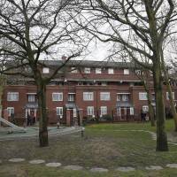 The playground and garden on an estate are seen in West London on Thursday. Local media reported that Mohammed Emwazi used to live nearby. Investigators believe that the \"Jihadi John\" masked fighter who fronted Islamic State beheading videos is Emwazi, two U.S. government sources said on Thursday. | REUTERS