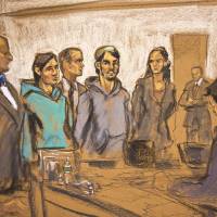 In this courtroom sketch, defendants Akhror Saidakhmetov (third from left) and Abdurasul Hasanovich Juraboev (fourth from right) stand in Federal Court at their arraignment Wednesday in Brooklyn, New York. They are charged along with a third man of plotting to travel to Syria to join the Islamic State group and wage war against the U.S., and federal officials said one of them spoke of shooting President Barack Obama or planting a bomb on Coney Island. | AP