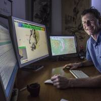 John Vidale,  director of Pacific Northwest Seismic Network, shows the earthquake early warning system at the University of Washington on Feb. 9 in Seattle. Companies including Boeing, Alaska Airlines and Intel will be able to work with the system and figure out how to make use of warning times. Tests of the system started Tuesday. | AP/THE SEATTLE TIMES, STEVE RINGMAN