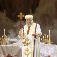 Pope Tawadros II, the 118th pope of the Coptic Orthodox Church of Alexandria and Patriarch of the See of St. Mark Cathedral, leads mass prayers for the 21 Egyptian Christians beheaded in Libya, at Saint Mark\'s Coptic Orthodox Cathedral in Cairo on Tuesday. Egyptian President Abdel Fattah Al-Sisi called for a United Nations resolution mandating an international coalition to intervene in Libya after Egypt\'s air force bombed Islamic State targets there. He also visited Egyptian border areas with Libya on a security tour. | REUTERS