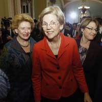 Backed with &#36;1.25 million from liberal advocacy groups, the group Run Warren Run has opened offices in early primary states New Hampshire and Iowa, hoping Sen. Elizabeth Warren (center) will enter the 2016 presidential race. | REUTERS