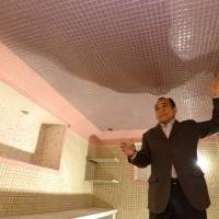 Hiroyasu Kato believes his father built and decorated this tiled air raid shelter after receiving his draft papers. Tiled air raid shelter in Aichi hailed as work of art