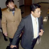 Sankei Shimbun journalist Tatsuya Kato appears in court Friday in Seoul for proceedings on his alleged defamation of South Korean President Park Geun-hye. | KYODO