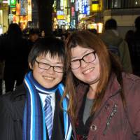 Kazuki Osawa (left), a transgender male who remains legally female, and his partner, Shoi Osawa, pose in Shinjuku Ward, Tokyo, on Jan. 30. | YOSHIAKI MIURA