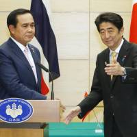 Prime Minister Shinzo Abe and Thai Prime Minister Prayuth Chan-ocha wrap up a joint news conference in Tokyo on Monday. | KYODO