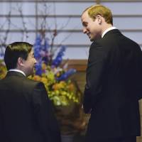 Britain’s Prince William, the Duke of Cambridge, is greeted by Crown Prince Naruhito upon his arrival at the Togu Palace in Tokyo on Friday. Prince William strikes a friendly contrast to Prince Naruhito
