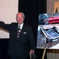 Yutaka Katayama, the \"father of the Z,\" waves to the media after introducing Nissan\'s new Z car concept during a news conference in Dearborn, Michigan in 1998. Katayama, who built the Z sports car into a powerful global brand in the 1970s, died Thursday, his son said. He was 105. | AP